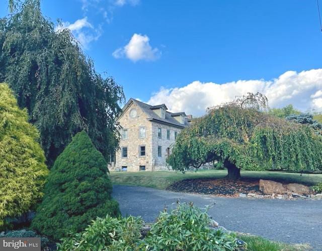 view of front of house with a water view