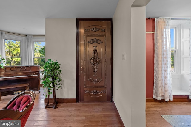 foyer entrance with light wood-type flooring