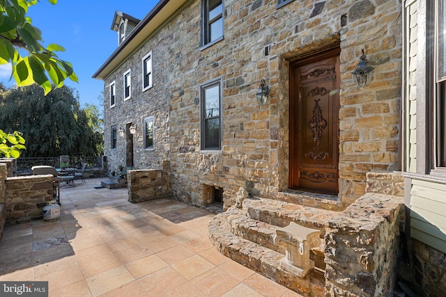 property entrance with a patio