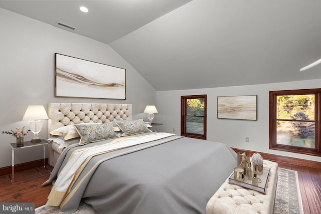 bedroom featuring vaulted ceiling and dark wood-type flooring