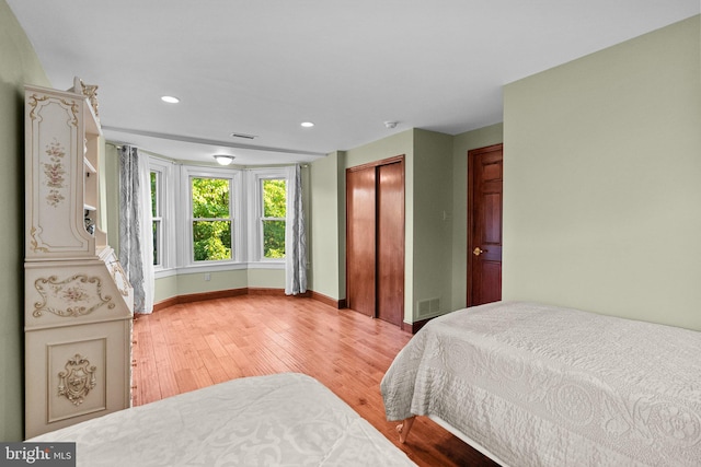 bedroom featuring a closet and hardwood / wood-style floors