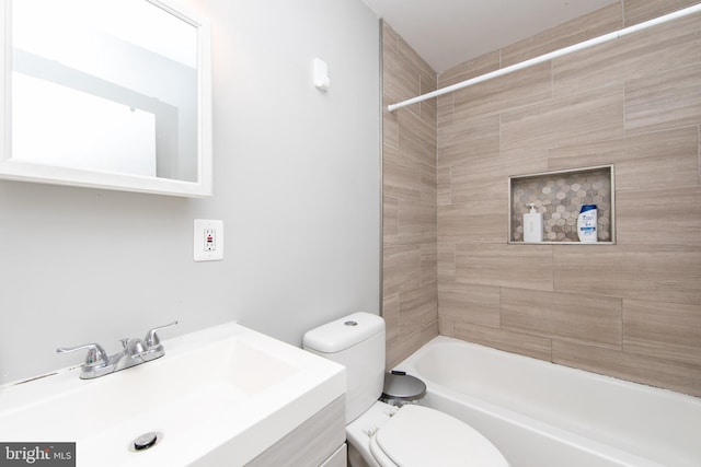 full bathroom with tiled shower / bath combo, vanity, and toilet