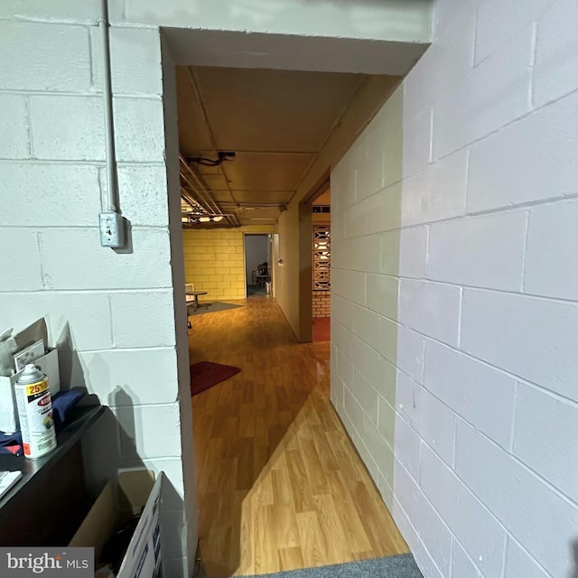 hallway with hardwood / wood-style floors