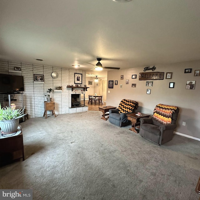 unfurnished living room with carpet floors, a fireplace, and ceiling fan