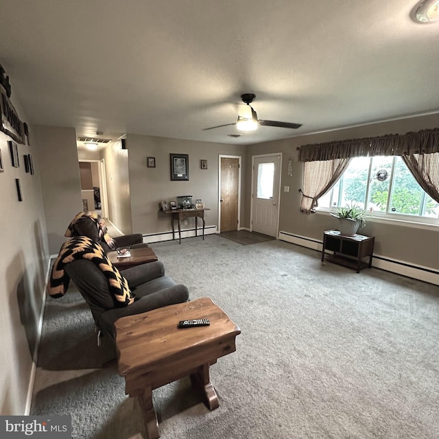 living room featuring a baseboard heating unit, carpet, and ceiling fan