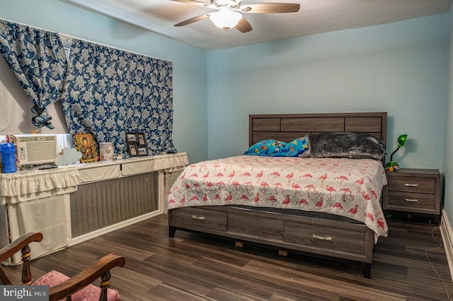 bedroom with ceiling fan and dark wood-type flooring