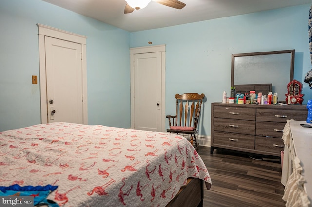 bedroom featuring ceiling fan and dark wood-type flooring