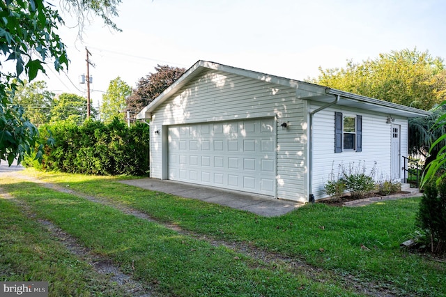 garage with a lawn