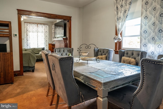 dining space with plenty of natural light and carpet floors