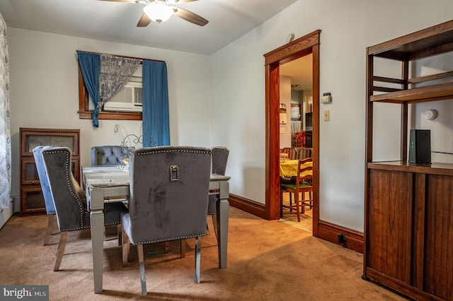 dining area with ceiling fan and carpet floors