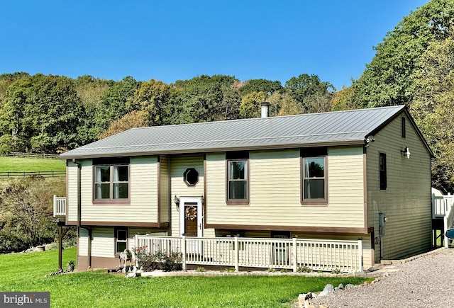 raised ranch with a front lawn