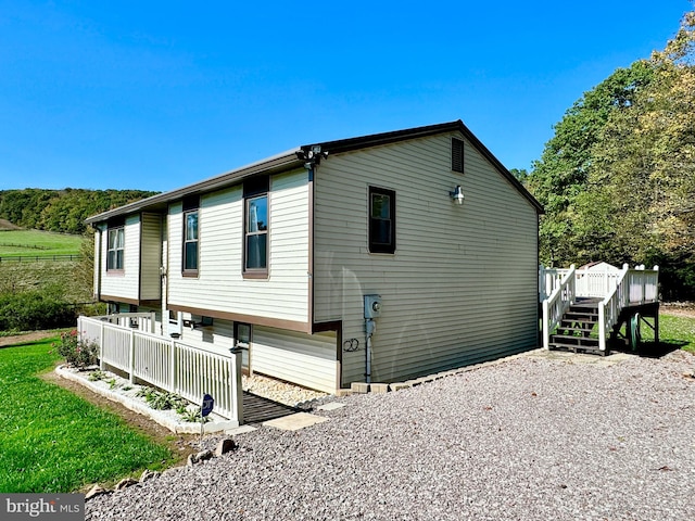 view of side of property with a deck