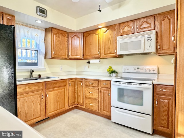 kitchen featuring sink and white appliances