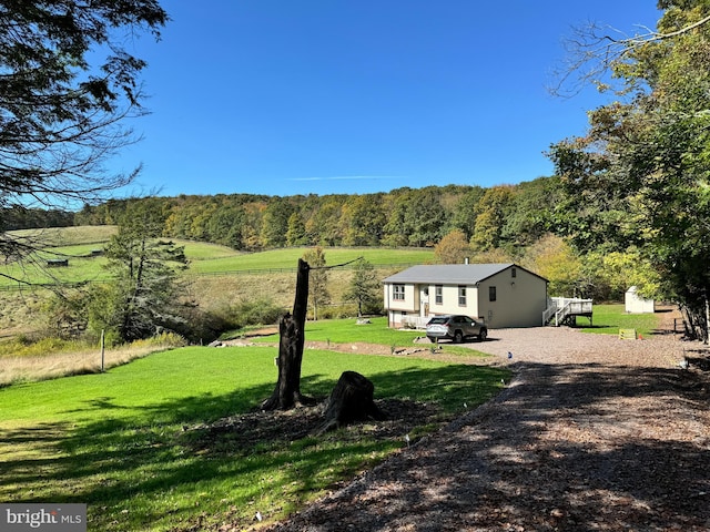 view of yard with a rural view