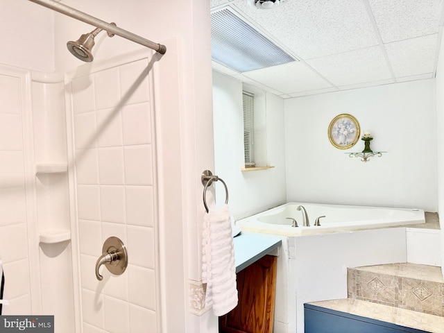 bathroom with vanity, separate shower and tub, and a paneled ceiling