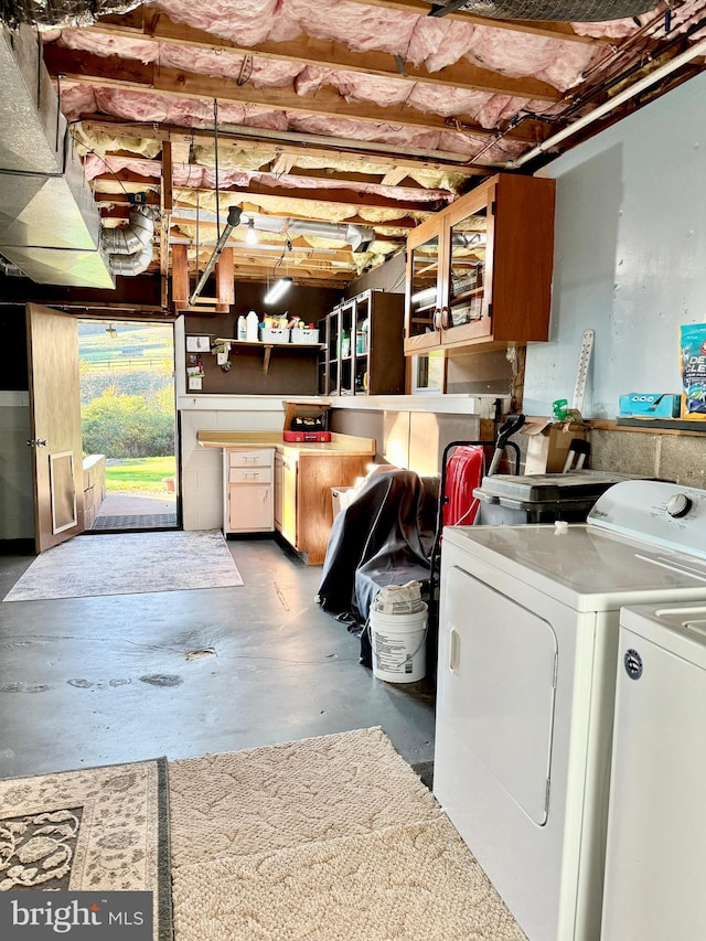 clothes washing area with washer and dryer