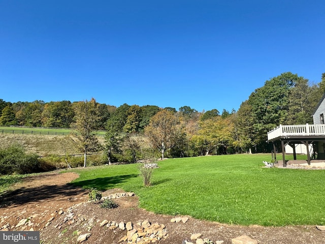 view of yard with a wooden deck