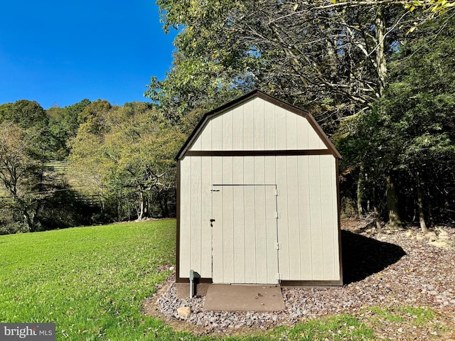 view of outdoor structure with a lawn