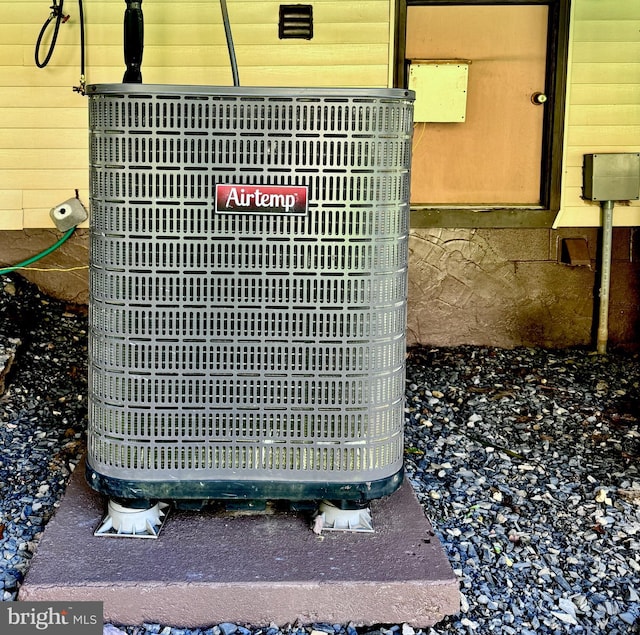 exterior details with central AC unit and wooden walls