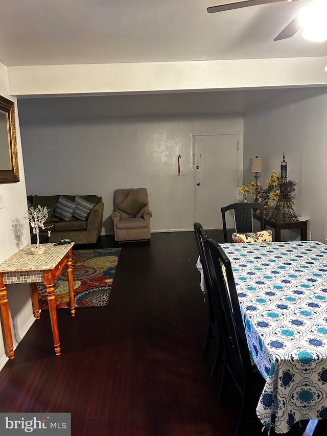 dining space with dark hardwood / wood-style floors and ceiling fan