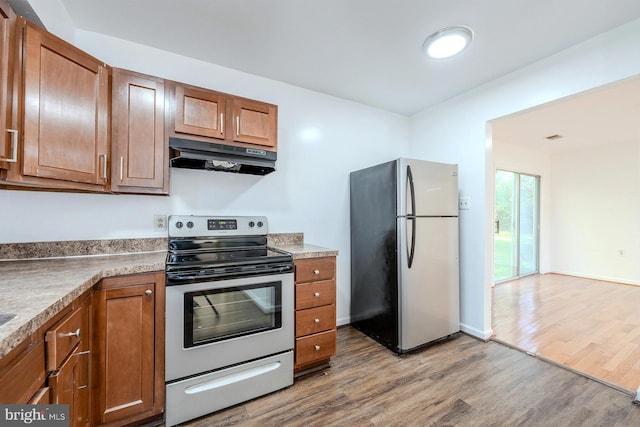 kitchen featuring light hardwood / wood-style flooring and stainless steel appliances