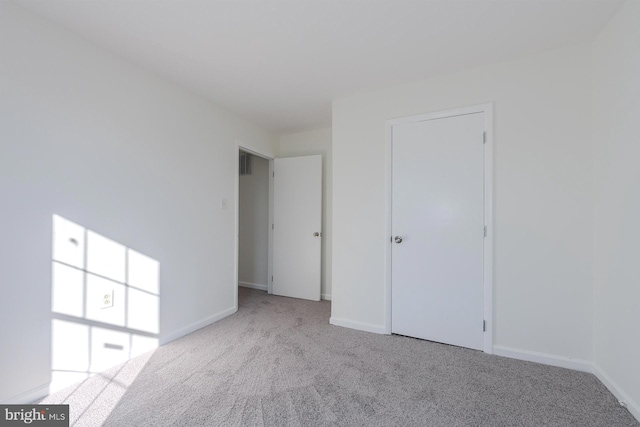 unfurnished bedroom with light carpet