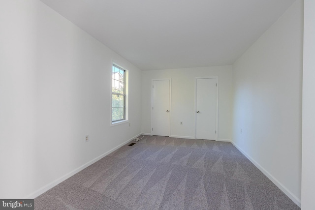 unfurnished bedroom with carpet floors