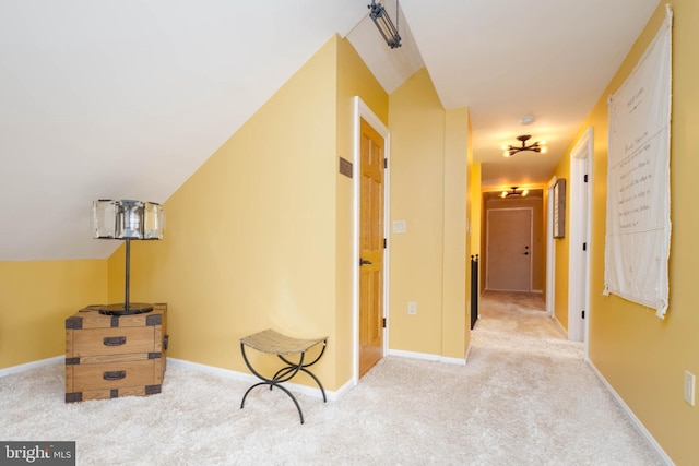 hallway featuring light carpet