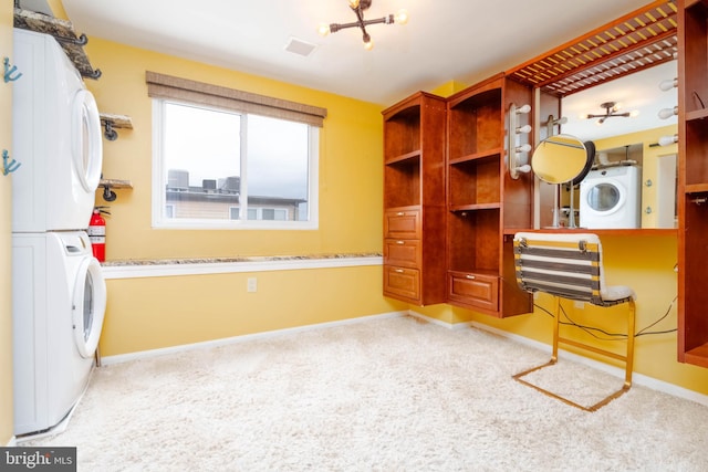 interior space featuring light carpet and stacked washer / drying machine