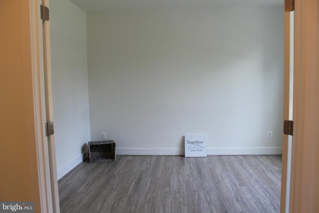 spare room featuring hardwood / wood-style flooring