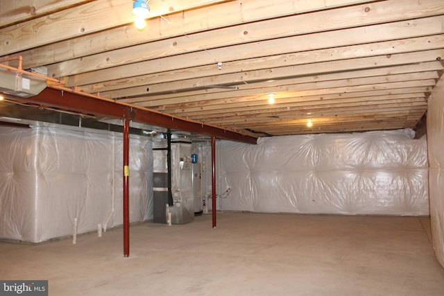 basement featuring heating unit