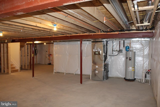 basement featuring water heater and heating unit