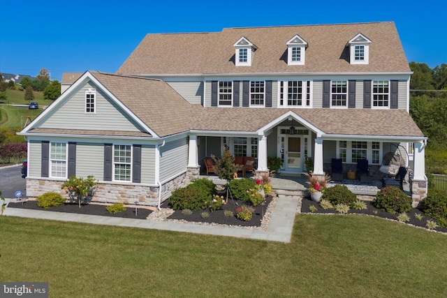 view of front of house featuring a front yard and a porch