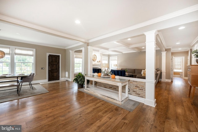 interior space featuring beamed ceiling, plenty of natural light, and dark hardwood / wood-style floors