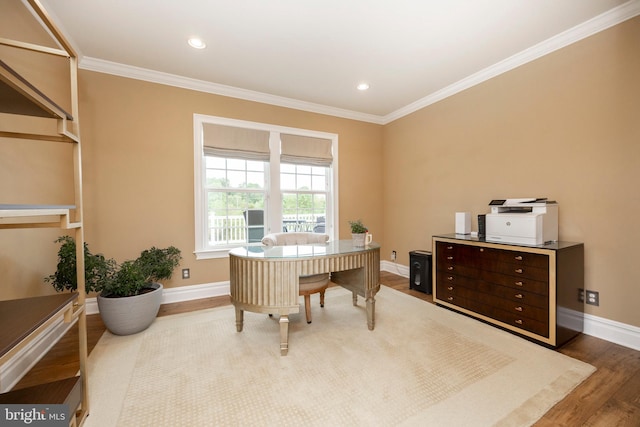 home office featuring crown molding and hardwood / wood-style flooring