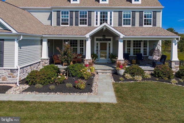 view of front of home featuring a porch and a front lawn