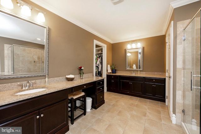 bathroom featuring crown molding, vanity, and a shower with shower door