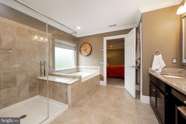 bathroom featuring vanity, independent shower and bath, ceiling fan, ornamental molding, and tile patterned floors