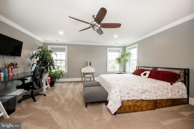 carpeted bedroom featuring crown molding and ceiling fan