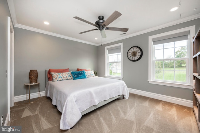 bedroom with ceiling fan, carpet floors, and crown molding