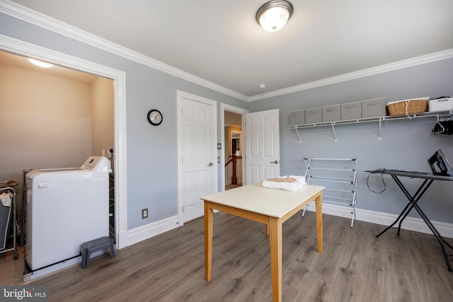 office space featuring washer / clothes dryer, hardwood / wood-style flooring, and ornamental molding