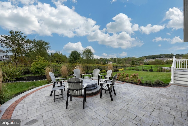 view of patio / terrace with a fire pit