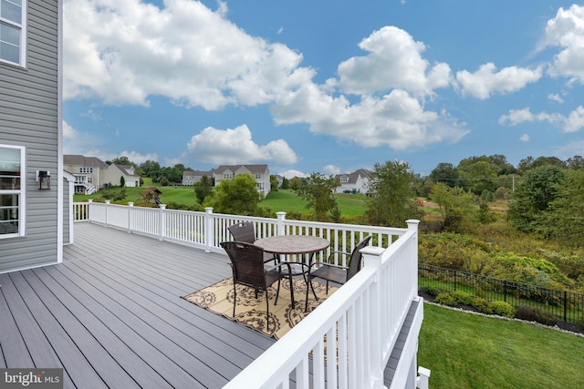 wooden terrace with a yard