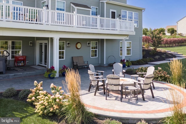 rear view of house featuring a patio