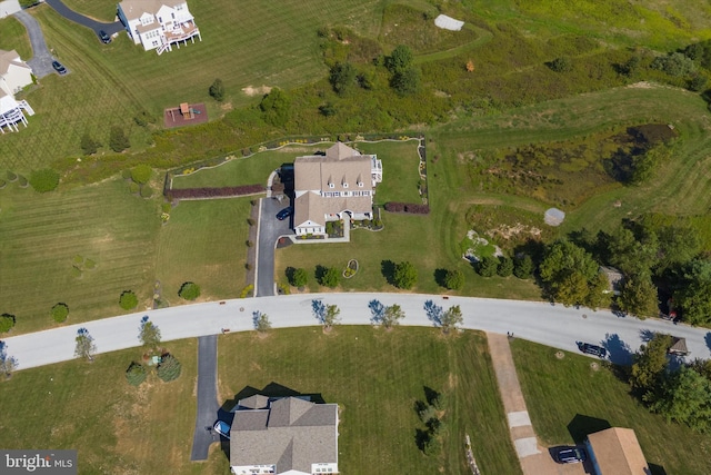 birds eye view of property with a rural view