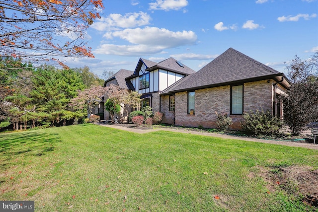 view of home's exterior with a yard