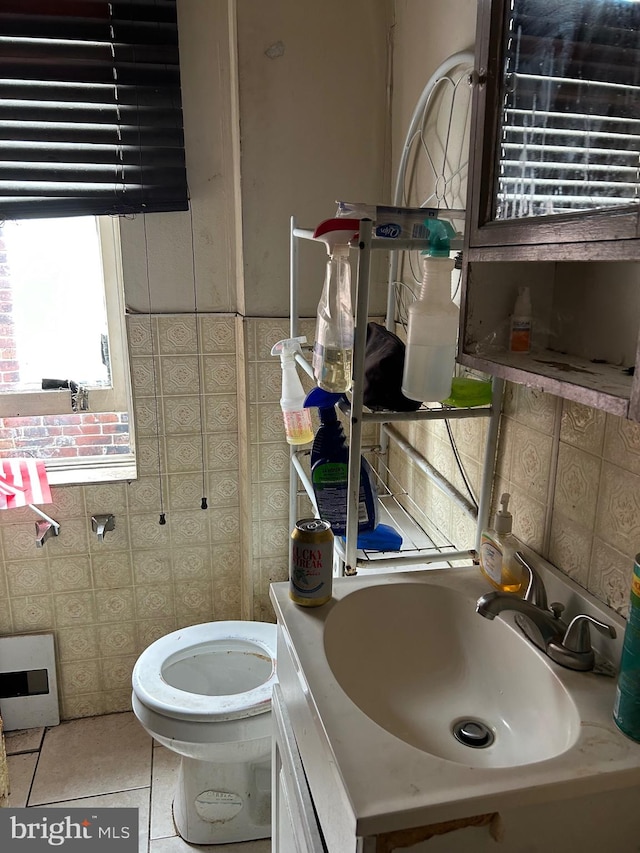 bathroom featuring tile walls, tile patterned flooring, vanity, and toilet