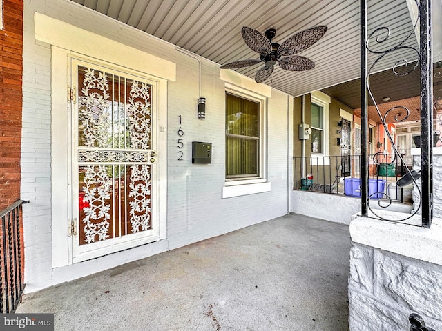 doorway to property featuring ceiling fan