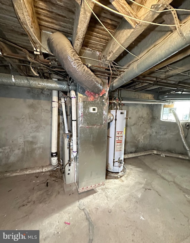 basement featuring gas water heater and heating unit