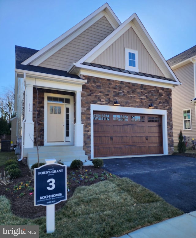 craftsman-style home featuring a garage